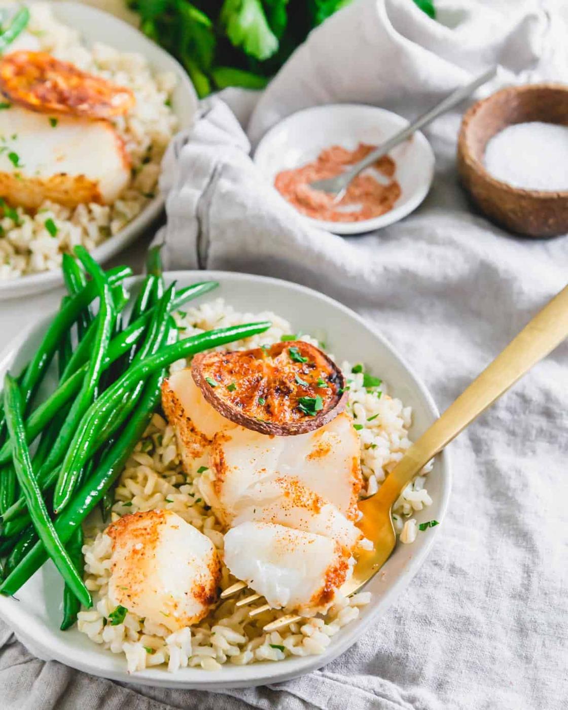 Cod cooked in the air fryer with simple spices and lemon is the perfect easy seafood dinner.