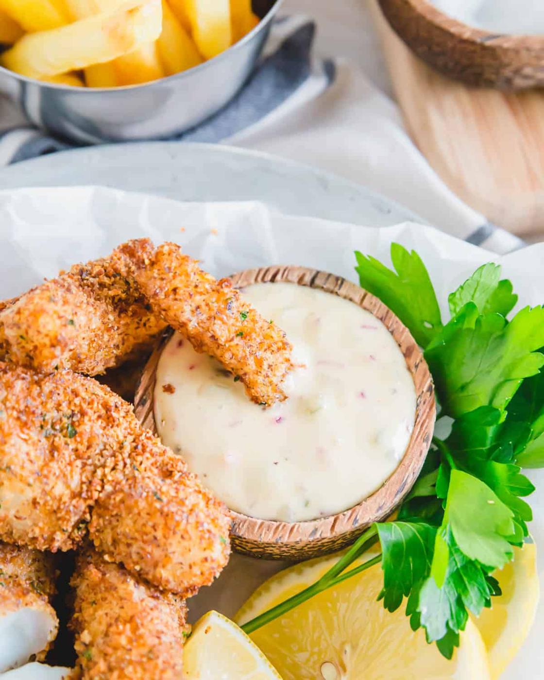 An easy gluten-free and eggless recipe for fish sticks baked in the air fryer until super crispy.