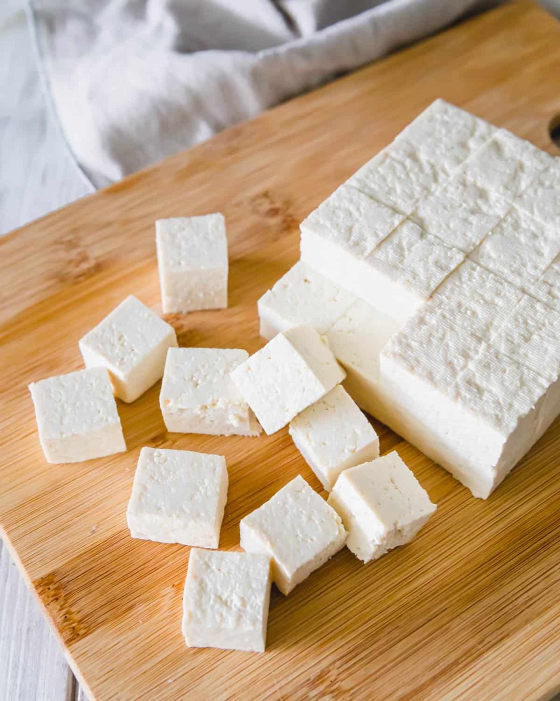 Extra firm tofu, pressed, cut into cubes and ready to be air fried.
