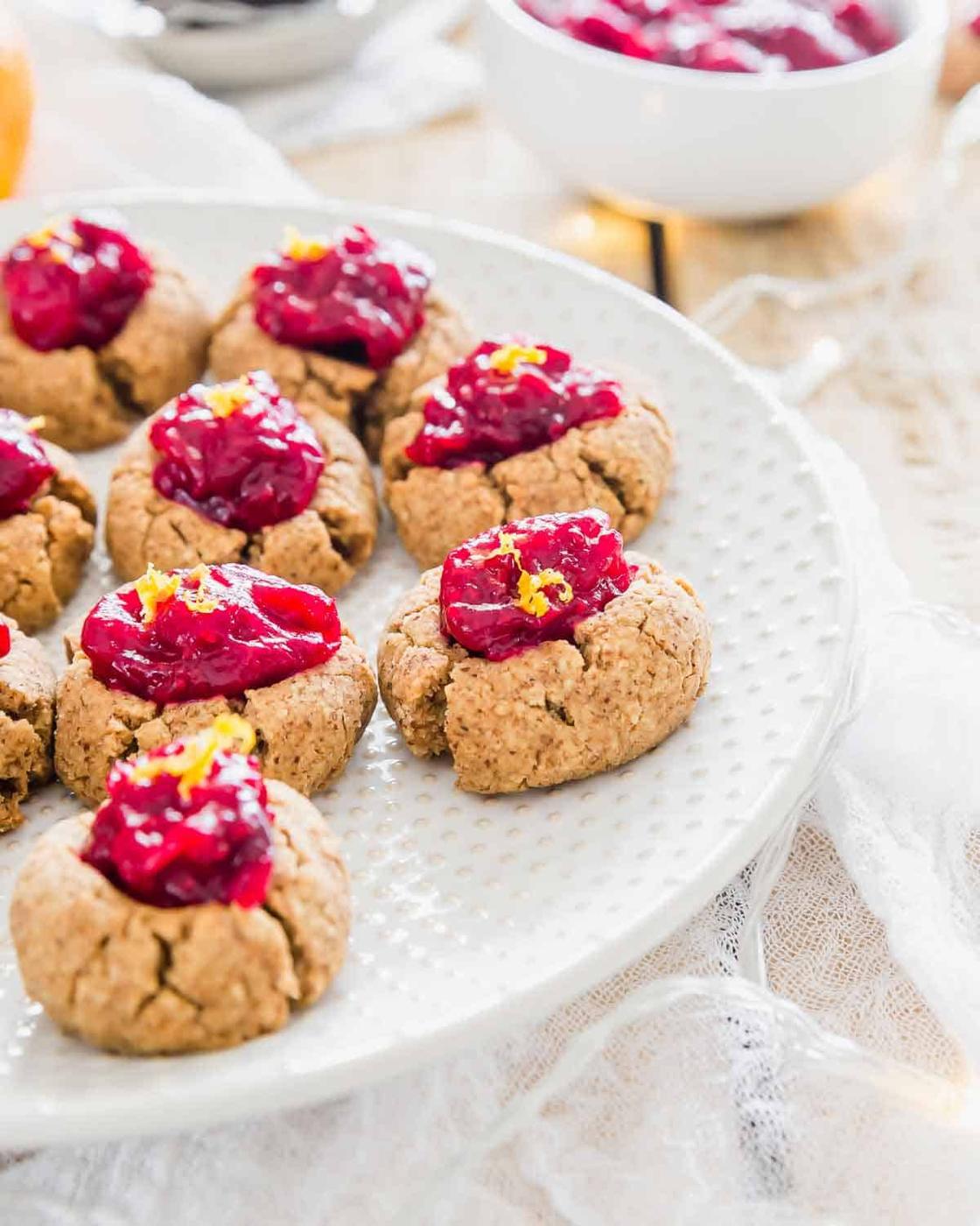 Thumbprint almond pulp cookies filled with an easy cranberry orange fruit jam.