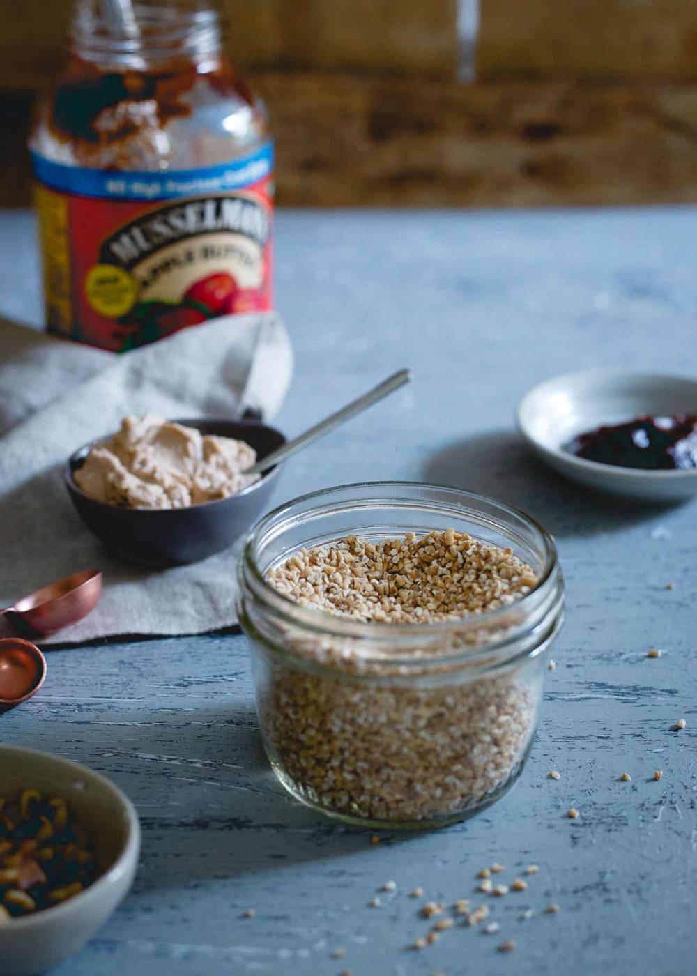 Slow cooker apple butter carrot cake oatmeal is made with hearty steel cut oats for a comforting breakfast bowl!