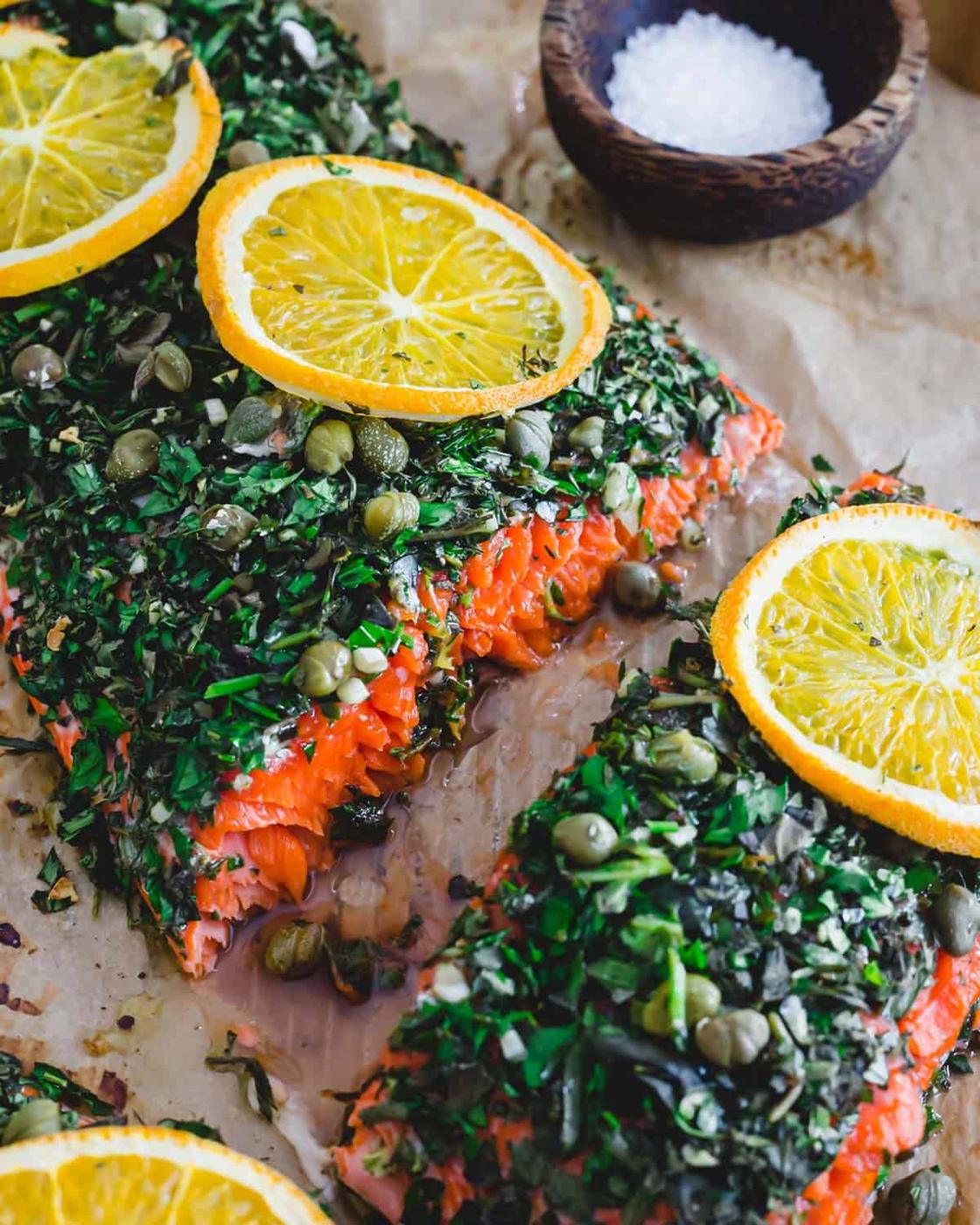 Wild sockeye salmon cut into servings on a baking sheet.