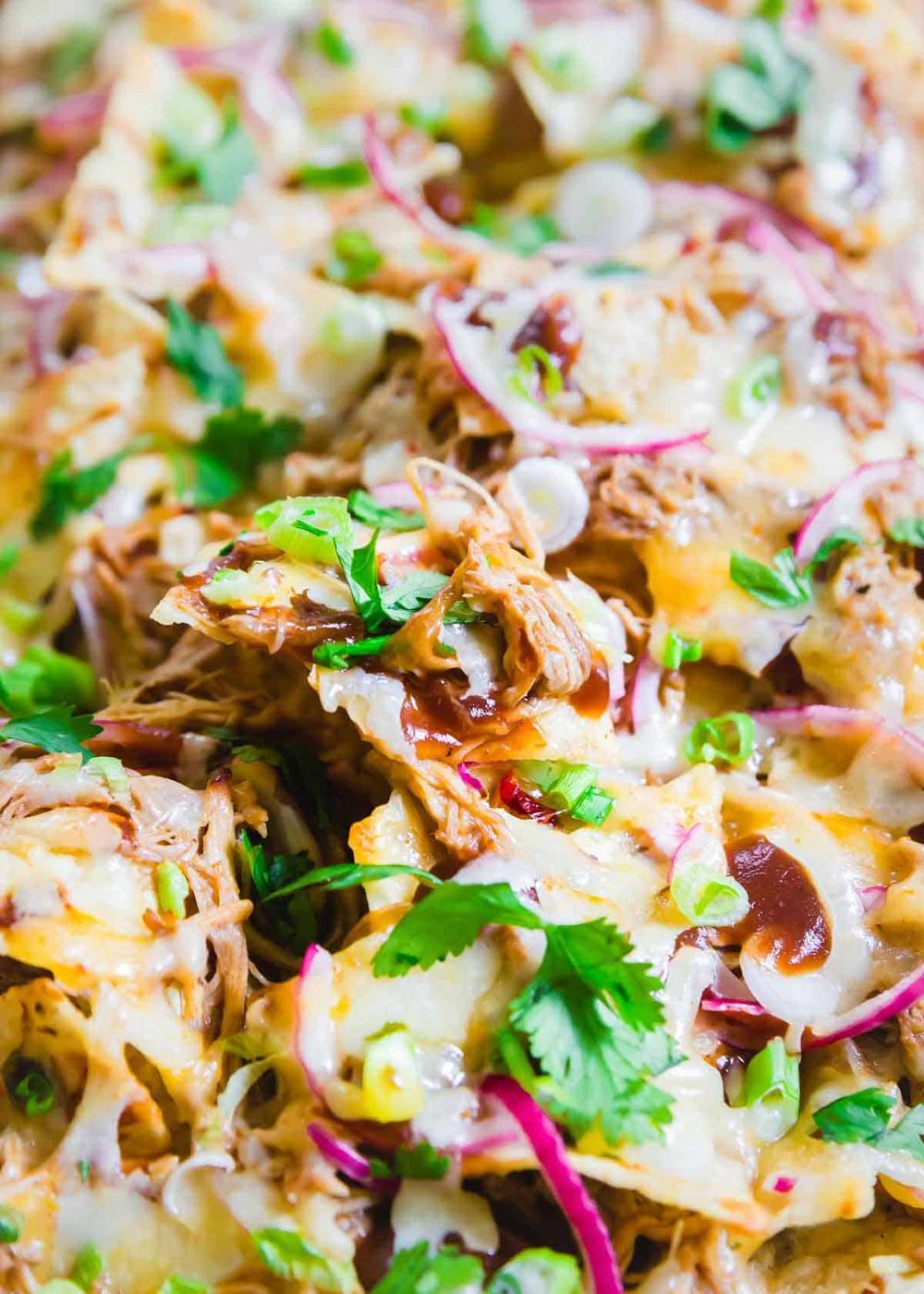 Pulled pork nachos are the ultimate game day recipe with BBQ pulled pork and lots of melted cheddar cheese.