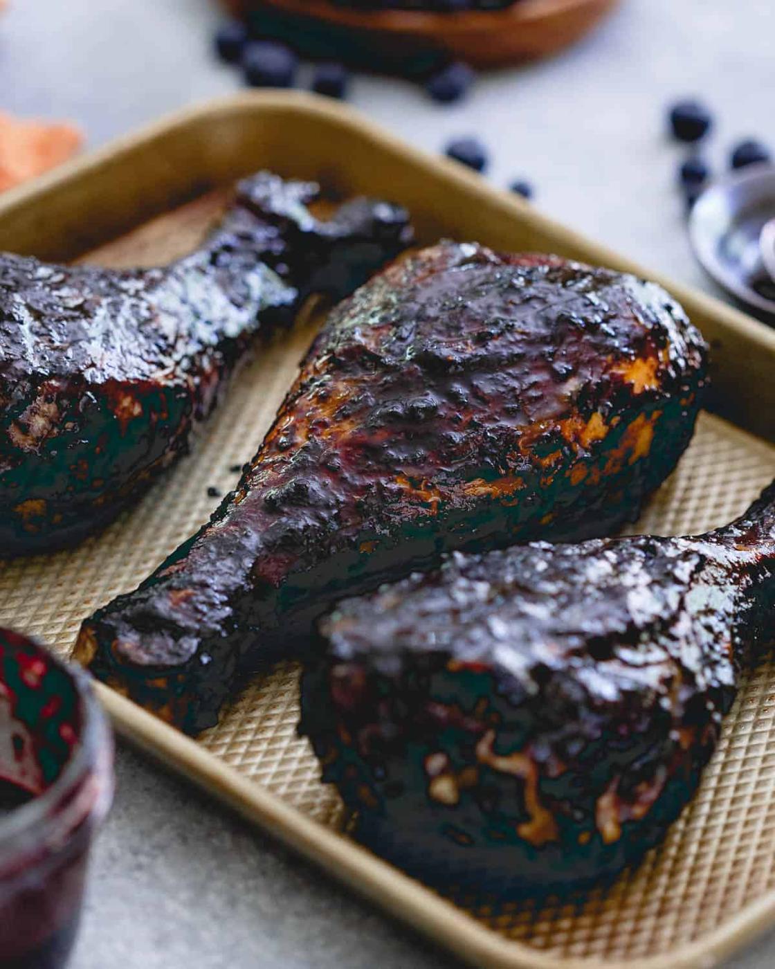 Summer is all about grilling and these easy grilled turkey legs coated in blueberry balsamic BBQ sauce are a delicious summer meal!