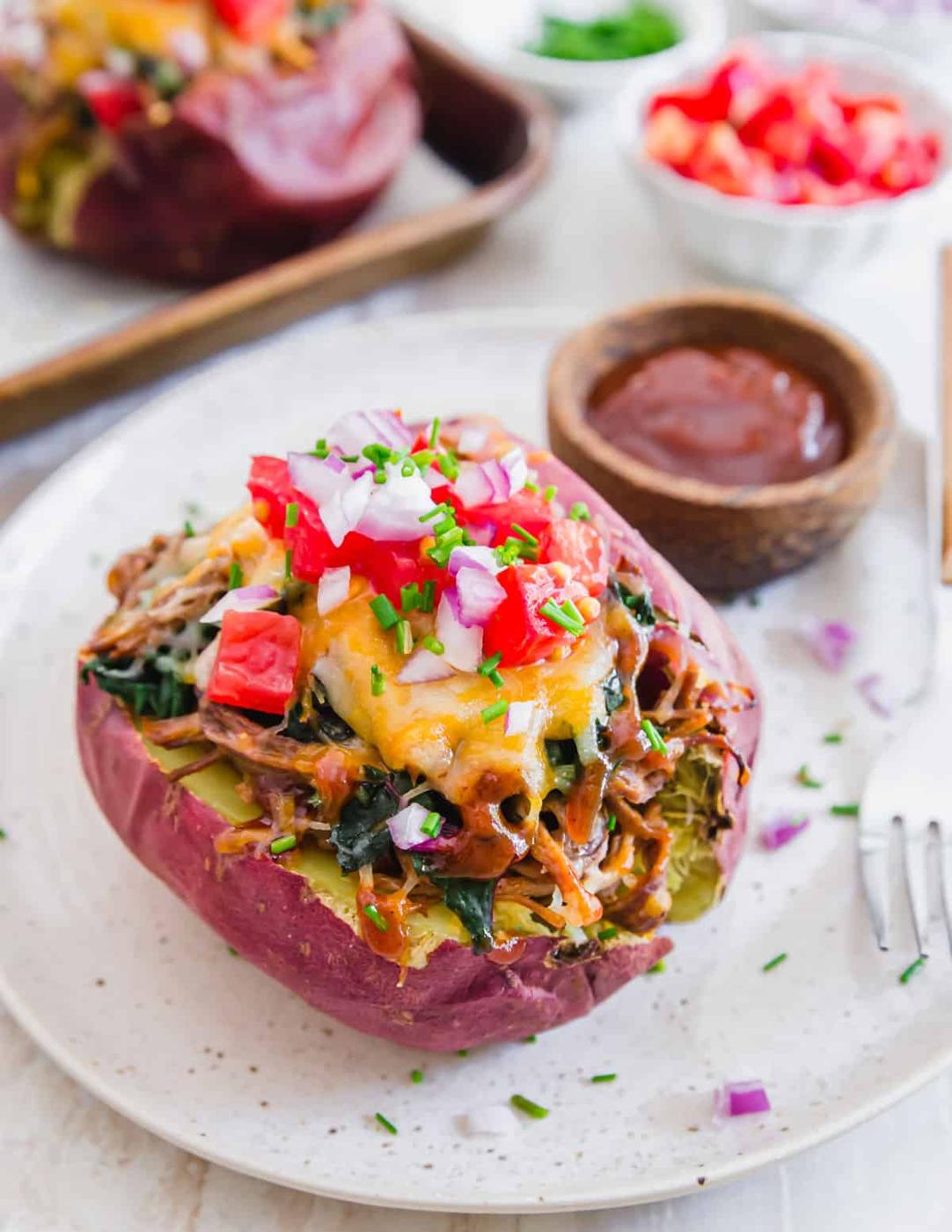 Use up leftover beef brisket in these easy baked brisket potatoes. Fill them with your favorite toppings, lots of cheese and a side of extra BBQ sauce for an easy dinner.