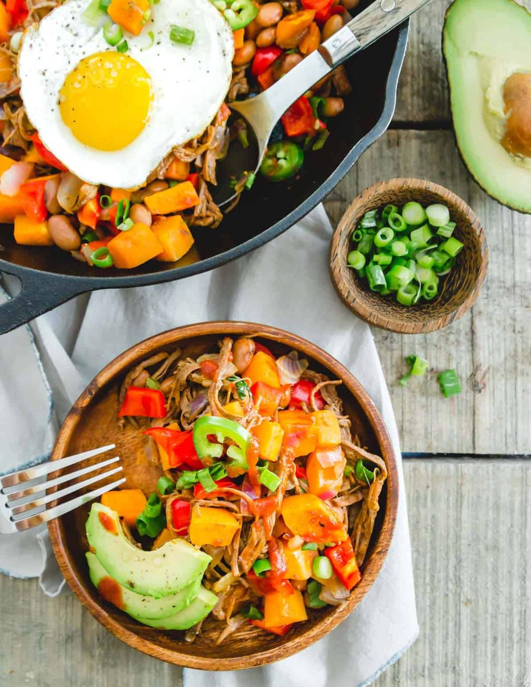 Easy brisket hash recipe using leftover beef brisket served with jalapeños, avocados, green onion and BBQ sauce.