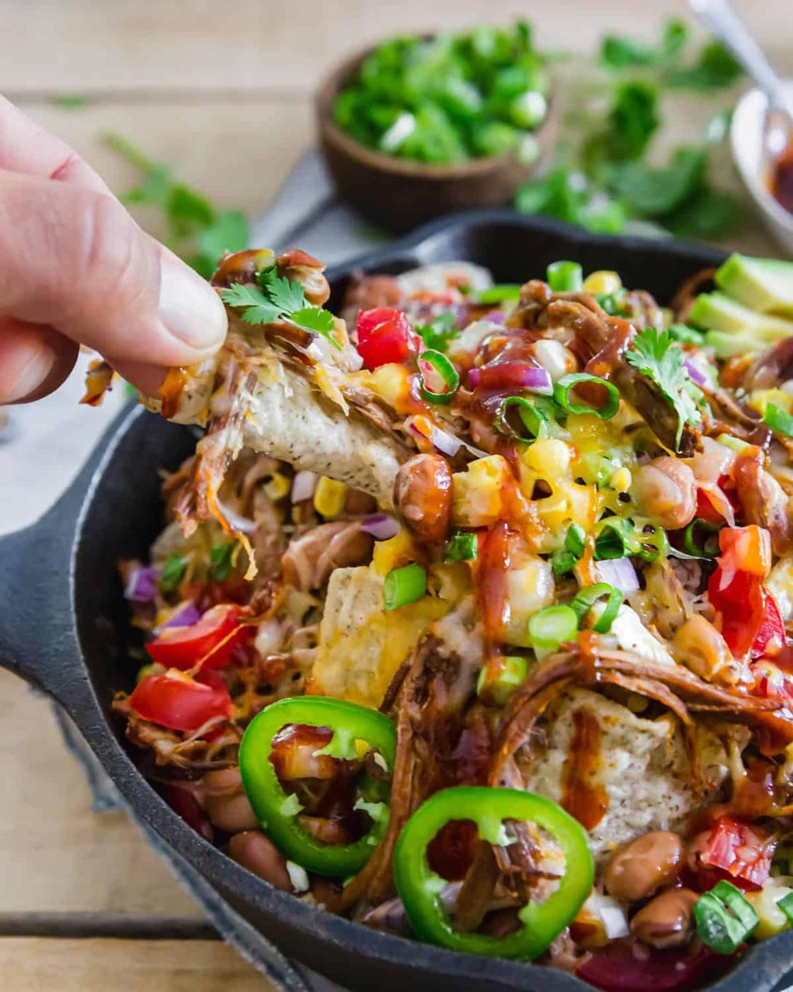 Brisket nachos are cheesy, spicy and full of BBQ flavor in this easy recipe that utilizes leftover beef brisket.