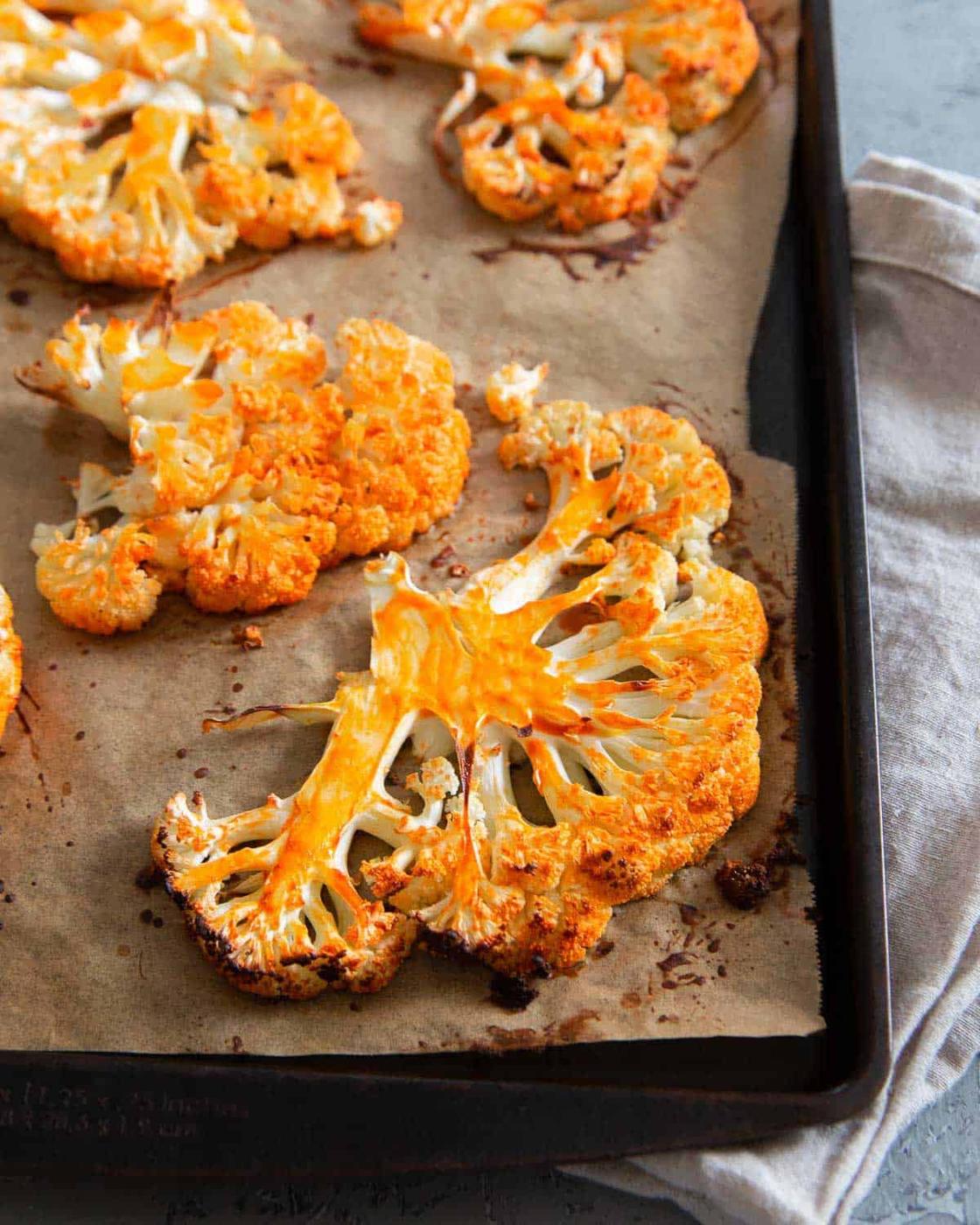Roasted buffalo cauliflower makes a great healthy alternative to wings when you crave buffalo flavor.