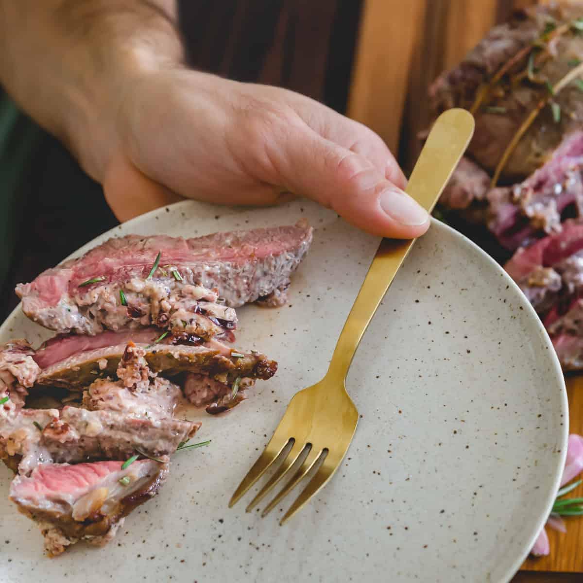 Medium rare butterflied leg of lamb roast recipe with goat cheese stuffing