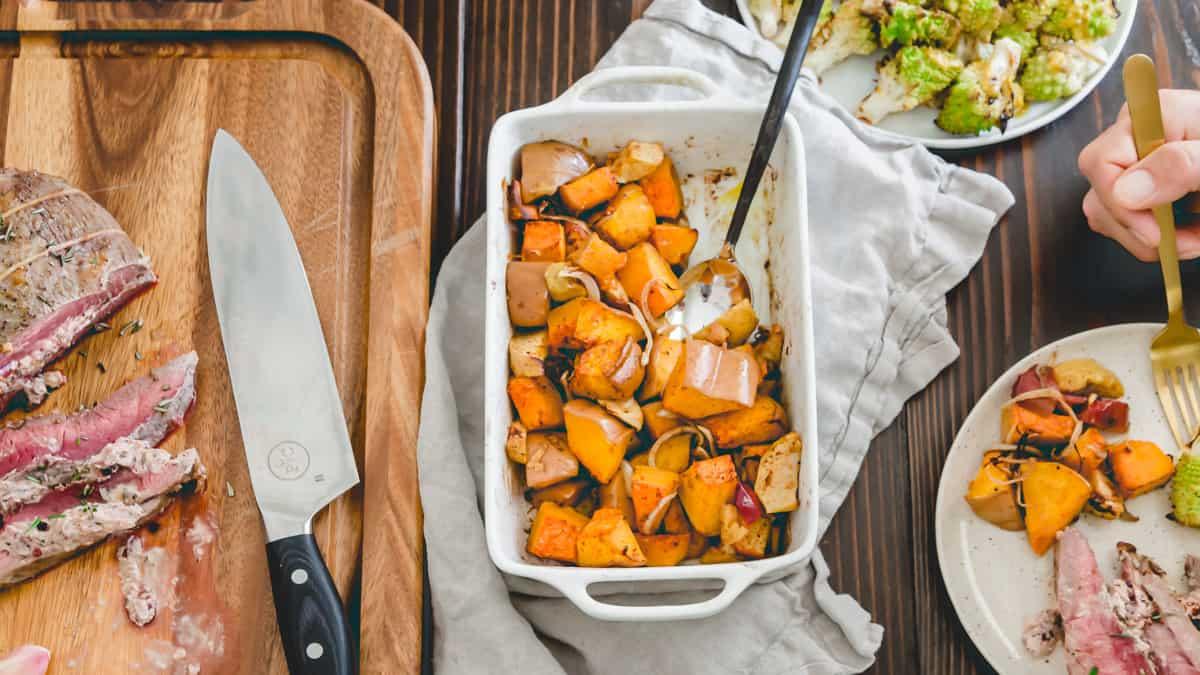 holiday meal of butterfly leg of lamb roast recipe with baked squash and apples and roasted romanesco