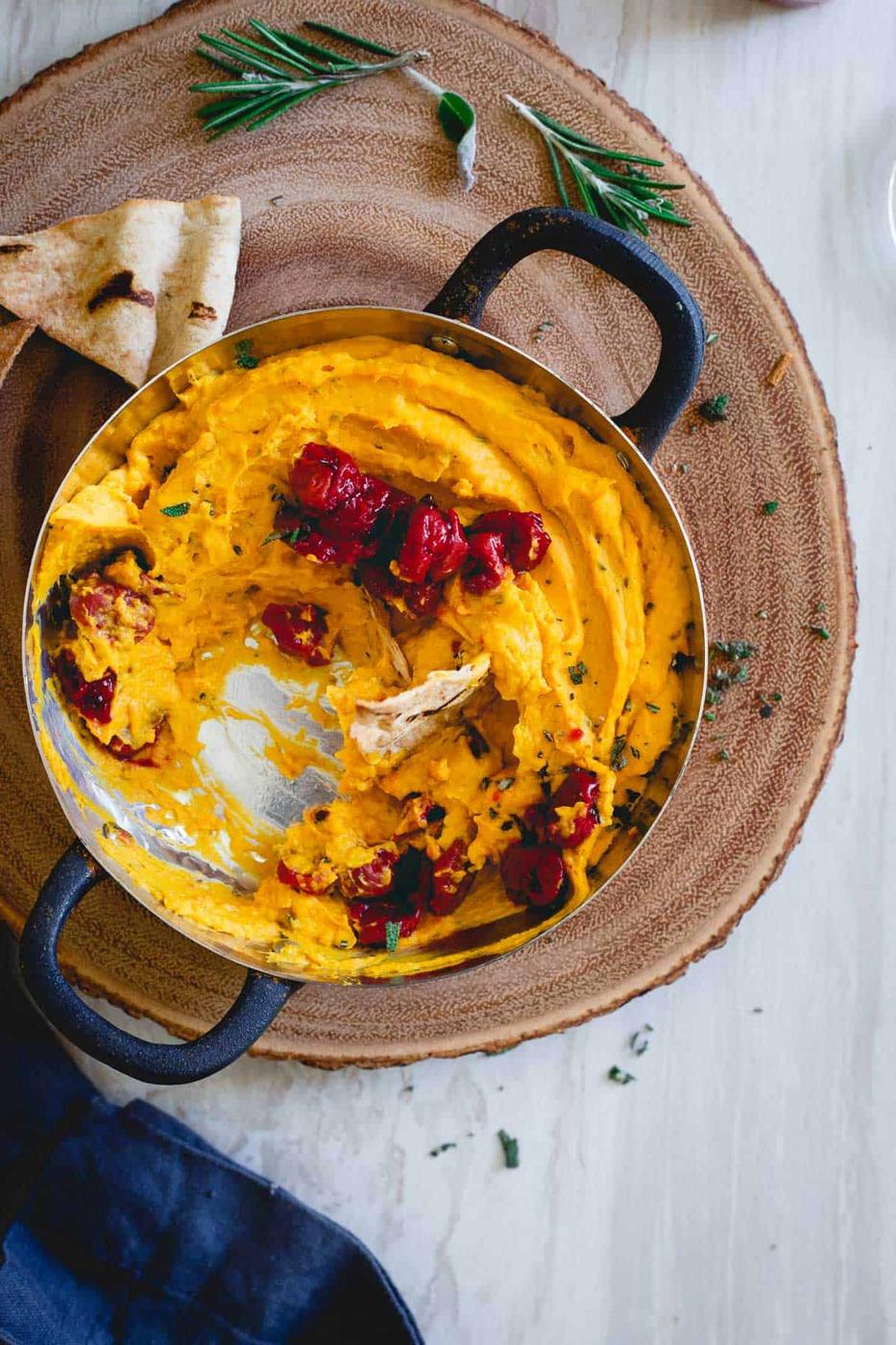 This festive butternut squash dip with cherry compote and fresh winter herbs is the perfect appetizer for your winter party.