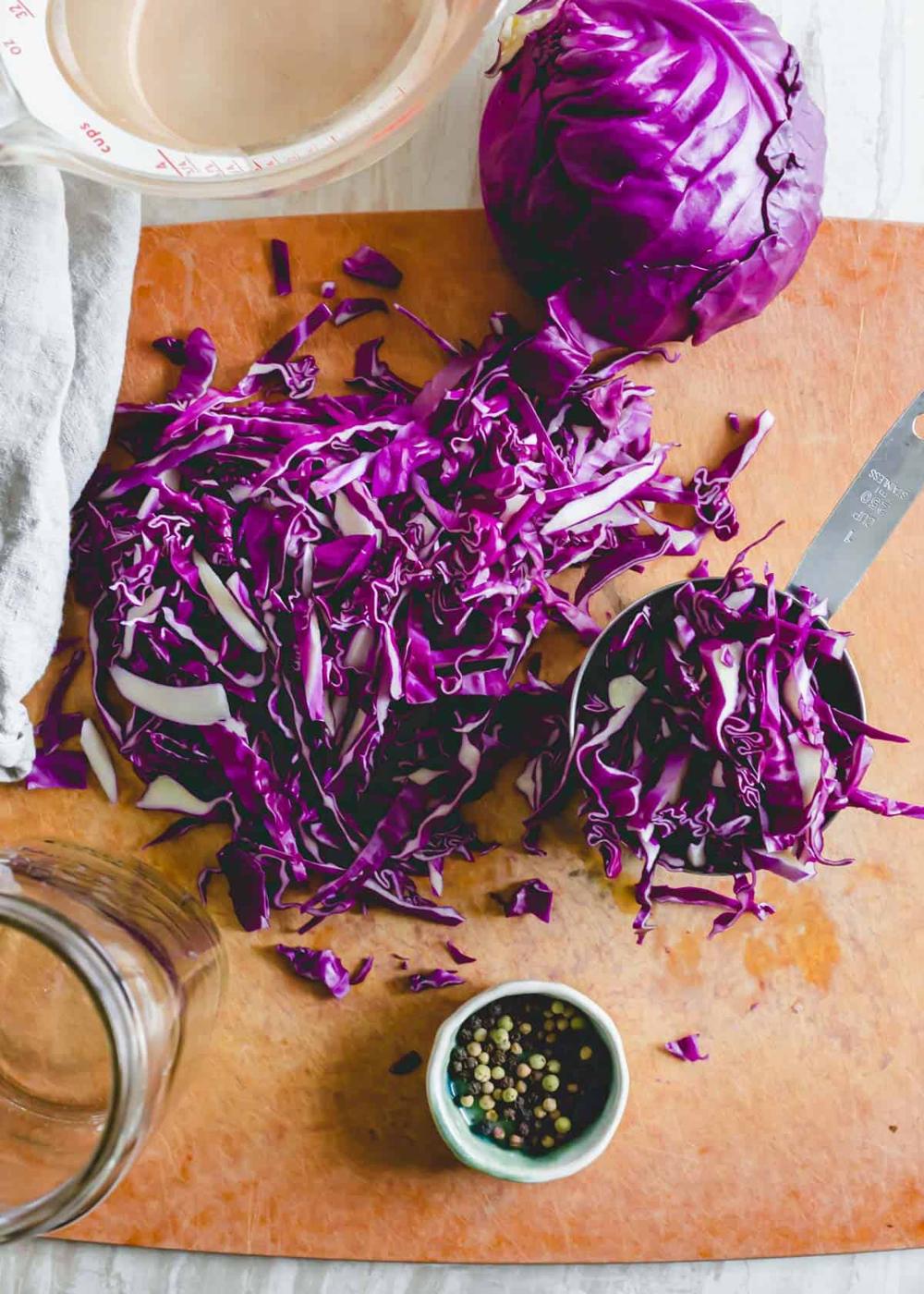 Finely chopped red cabbage on a cutting board.