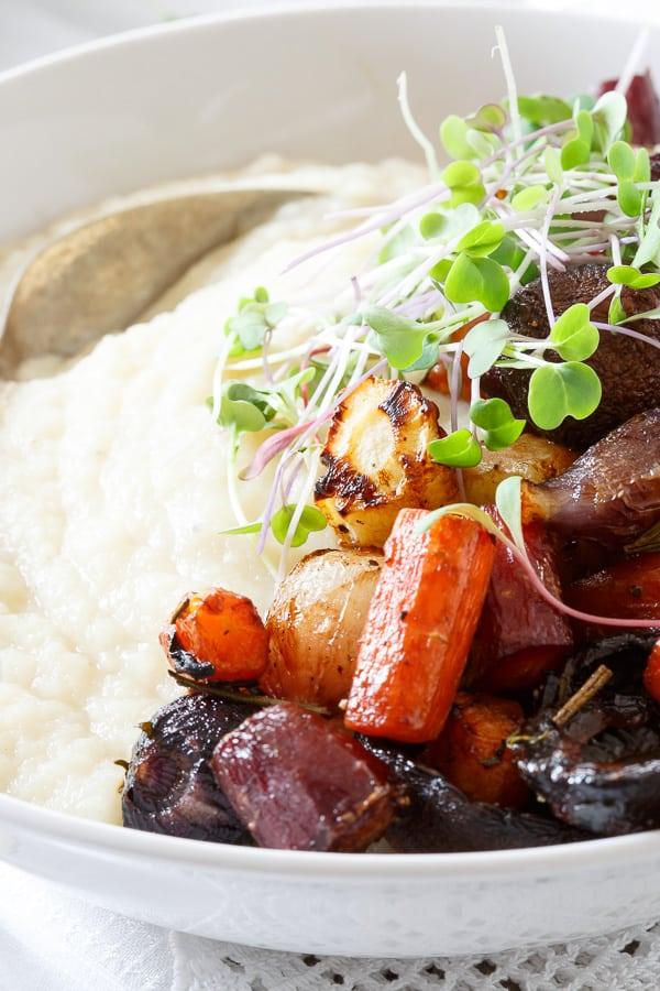 Roasted balsamic carrots, mushrooms and onions are served on top of a creamy celery root puree.