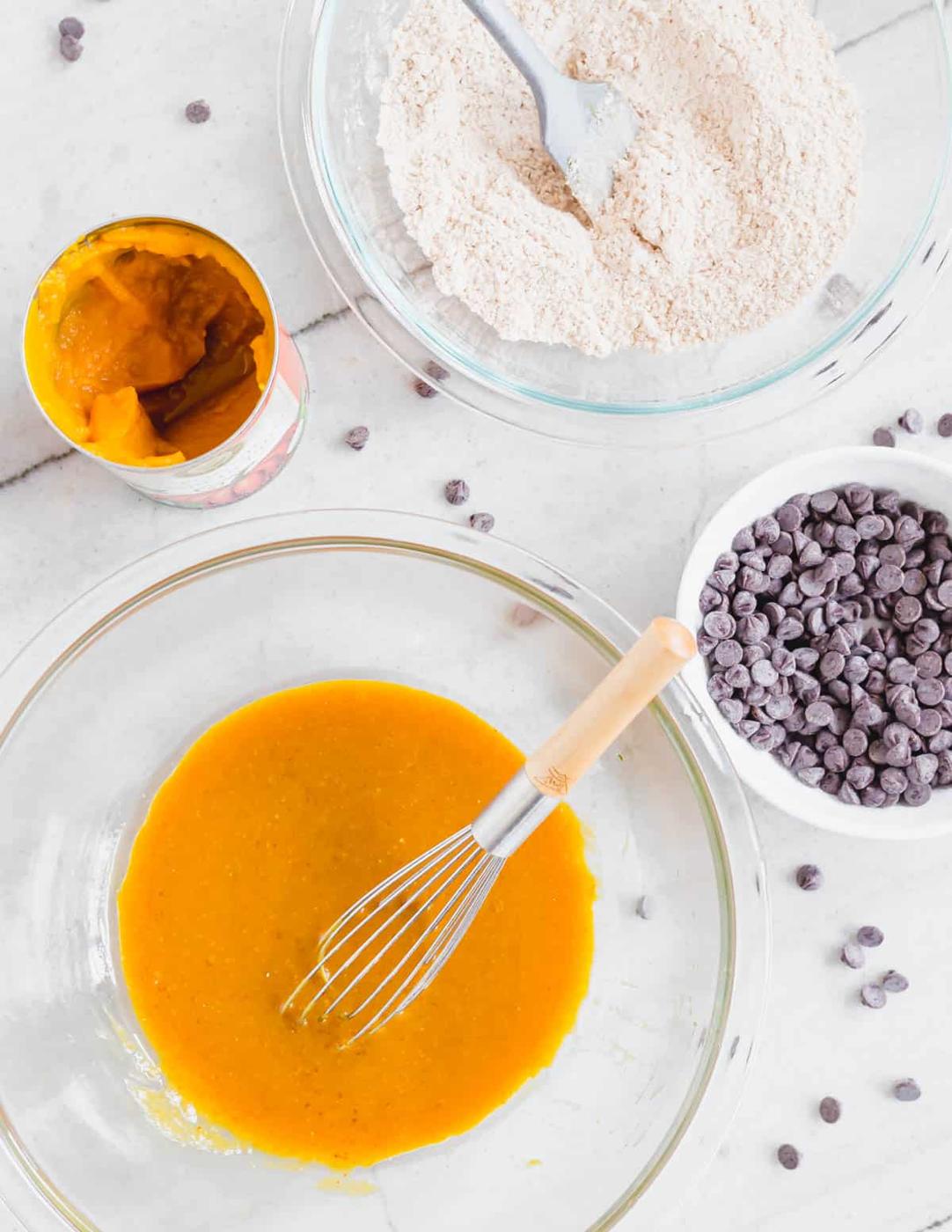 Ingredients in bowls to make vegan pumpkin cookies.