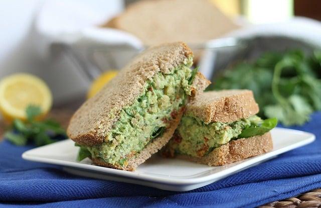 Pesto sandwich with smashed chickpeas is an easy protein packed vegetarian meal.
