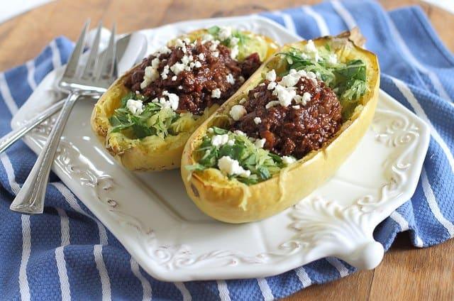 Chili stuffed spaghetti squash boats with feta cheese is a cozy, comfort food kind of meal that's healthy too!