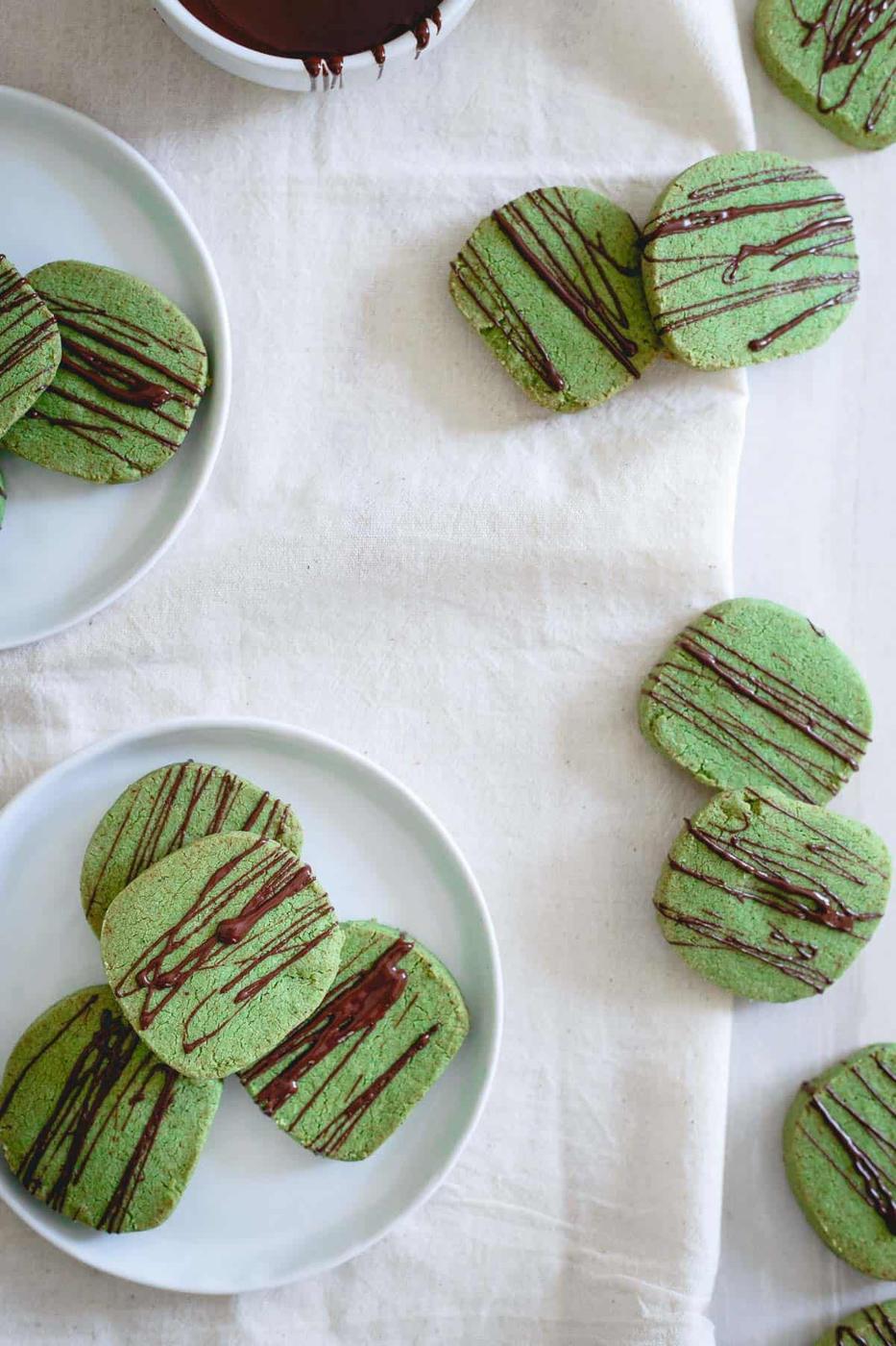 Festive and fun, these matcha shortbread cookies drizzled in chocolate are the perfect tea dunking accompaniment!