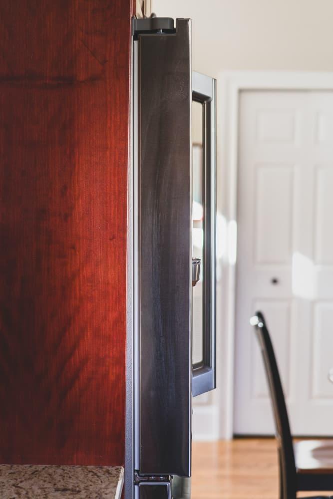 Sleek side profile of the Samsung Family Hub counter depth refrigerator.
