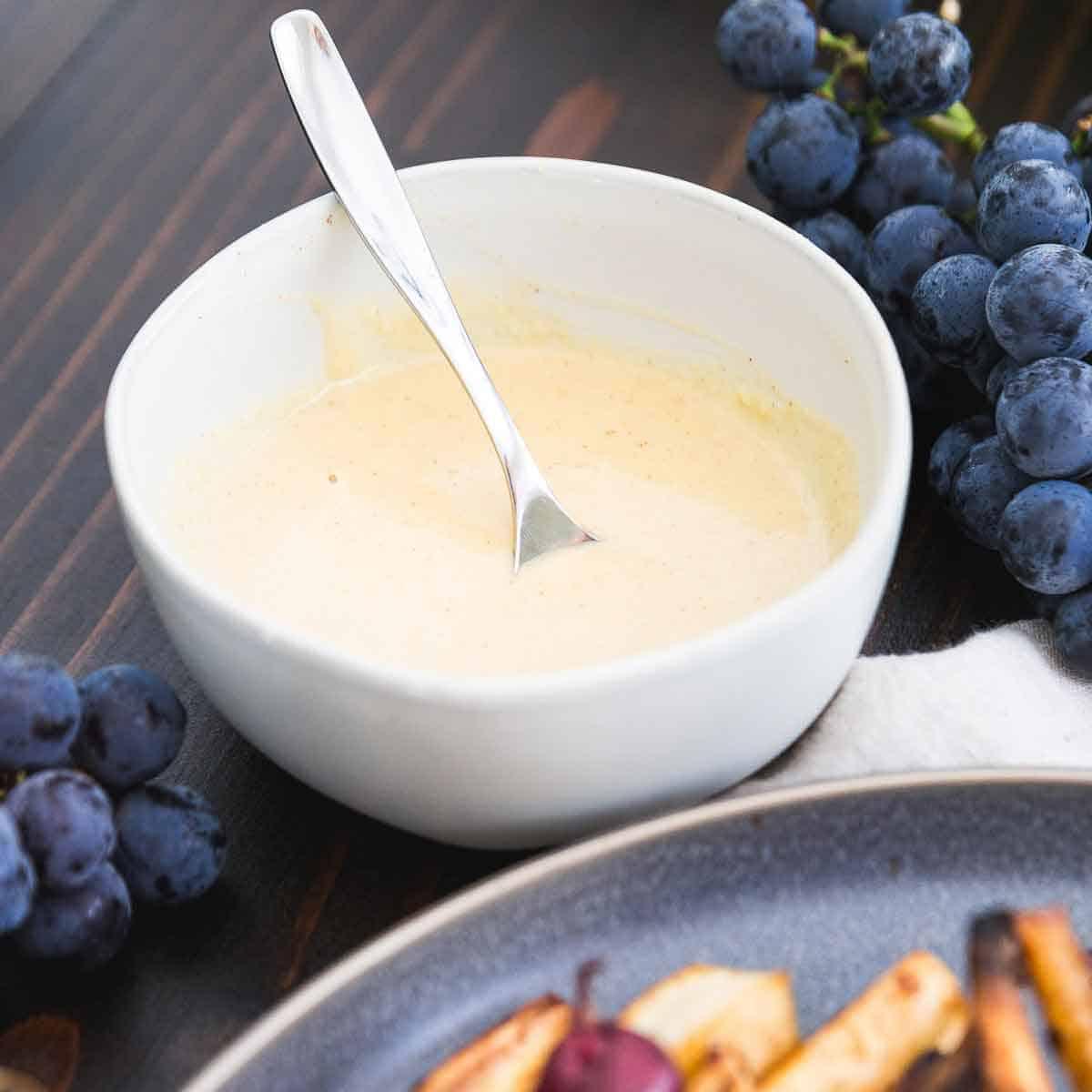 Sweetened with maple syrup and flavored with cinnamon and vanilla, this hummus dressing is the perfect sweet note drizzled on top of roasted parsnips.