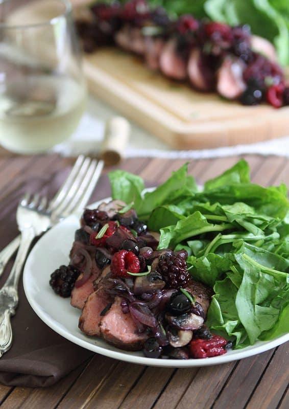 Spice rubbed pork tenderloin with crimini berry sauce