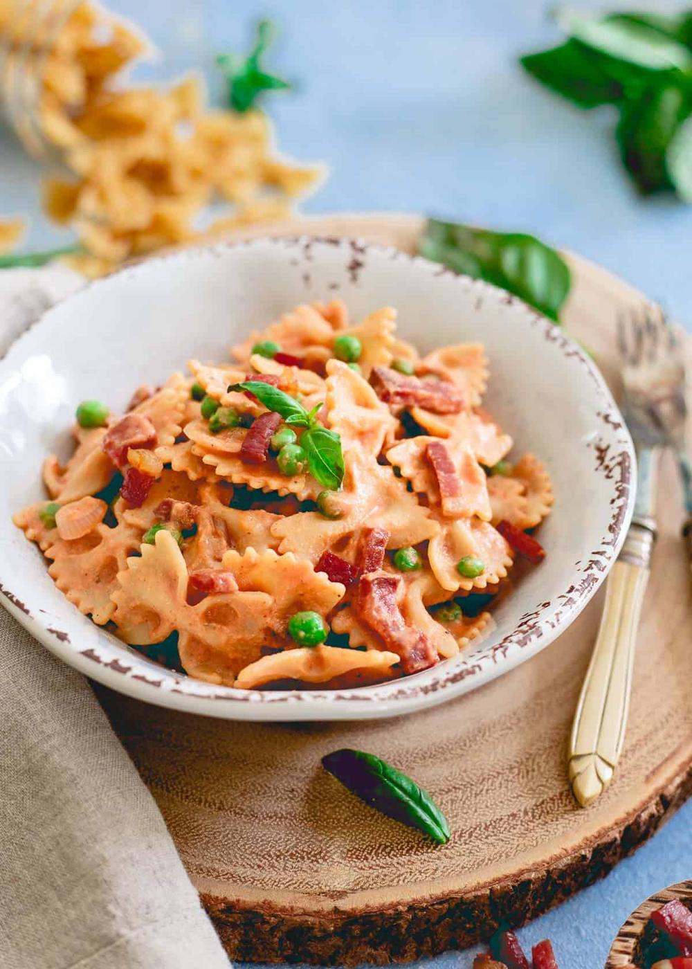 Creamy tomato sauce made right in your blender coats this easy pasta dish with peas and crispy prosciutto.