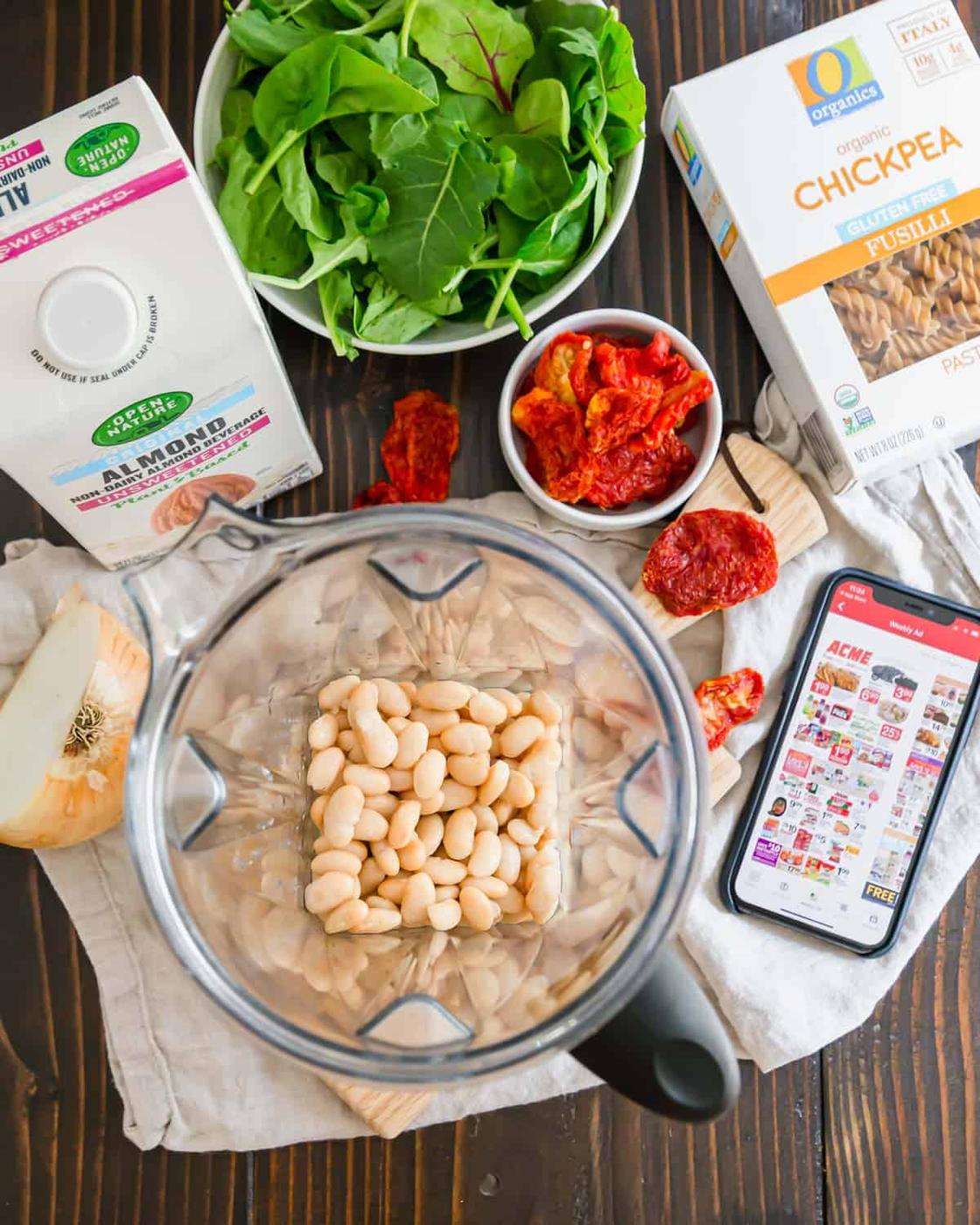 The creamy white bean sauce in this fusili pasta recipe is made with almond milk, onions, garlic and cannellini beans.