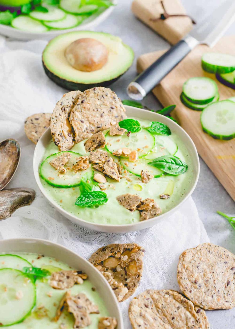 An easy recipe to make cucumber gazpacho in a blender served in bowls with seeded crackers.