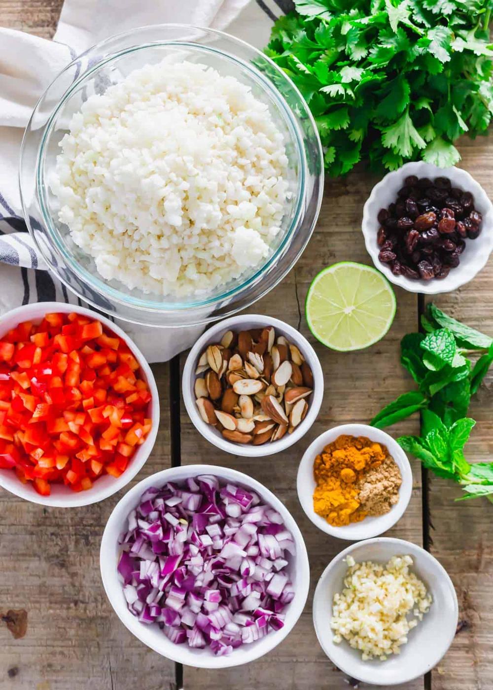 Prepped ingredients to make Indian curry cauliflower rice side dish.