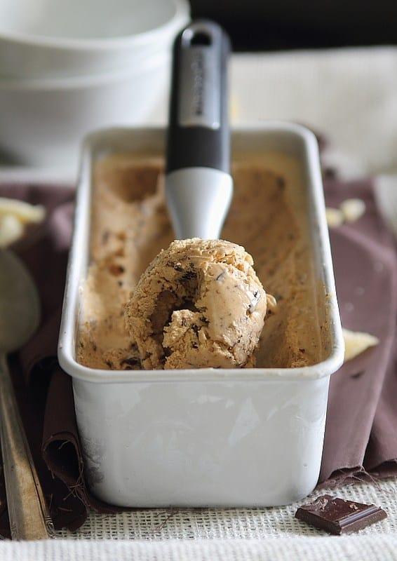 A scoop of gingerbread ice cream in the scooper.