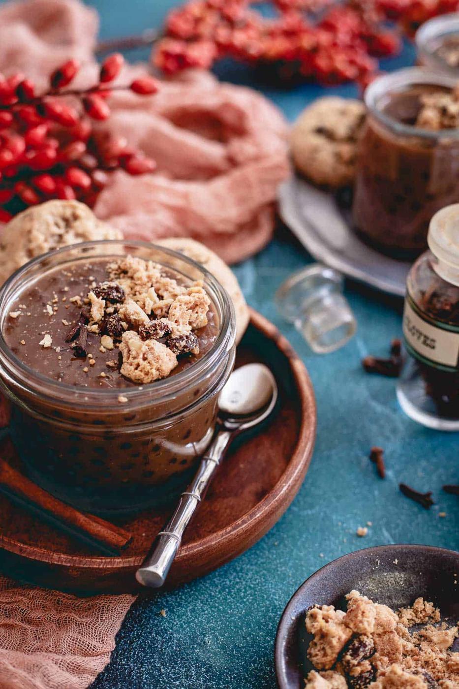 Dirty chai tapioca pudding is topped with gluten-free oatmeal raisin cookie crumble and makes a deliciously aromatic and decadent dessert.
