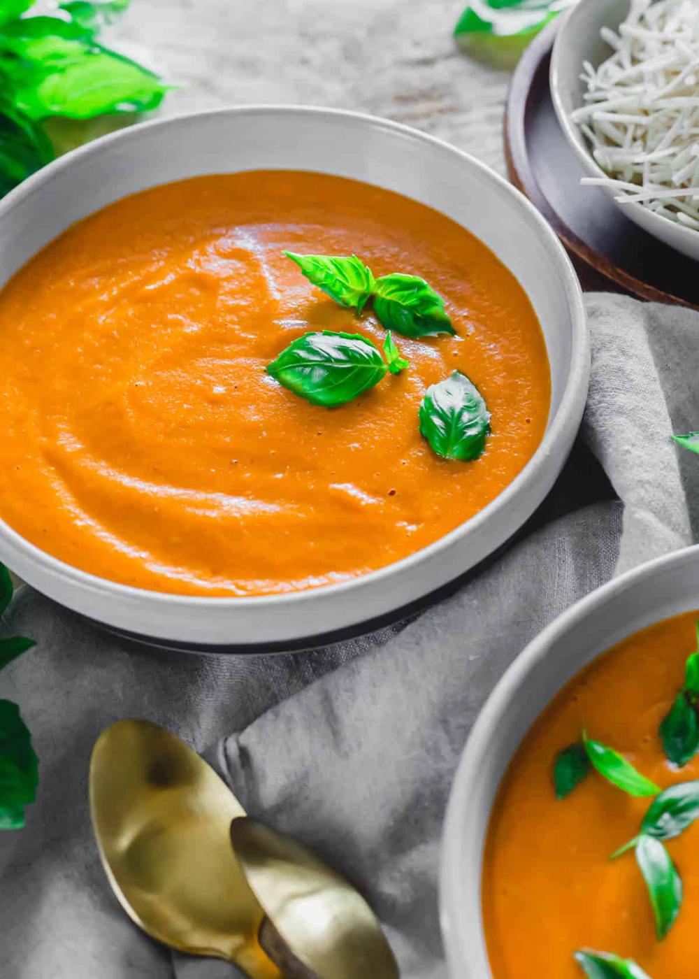 Creamy homemade roasted tomato basil soup in a bowl.