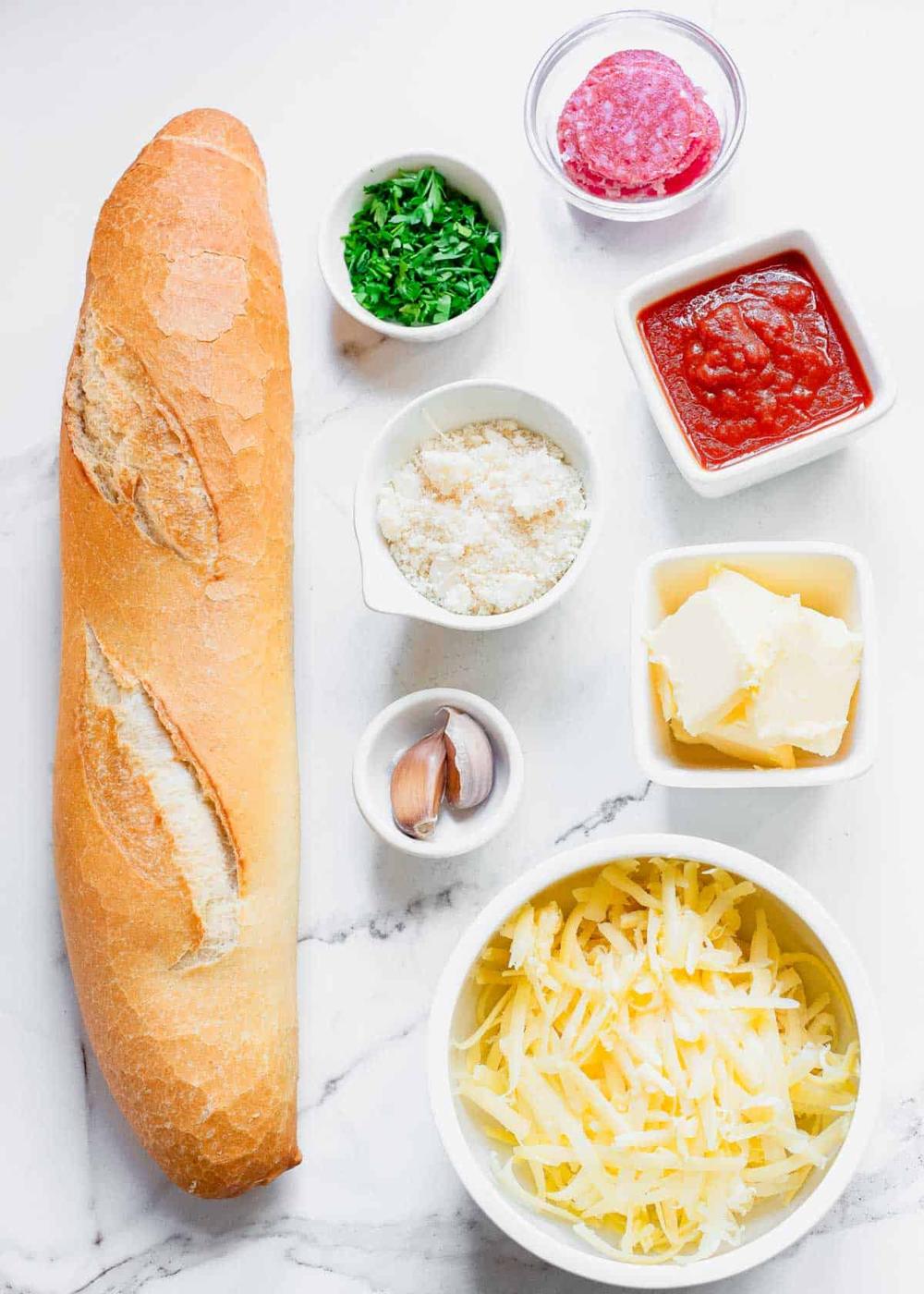 The ingredients for a french bread pizza.