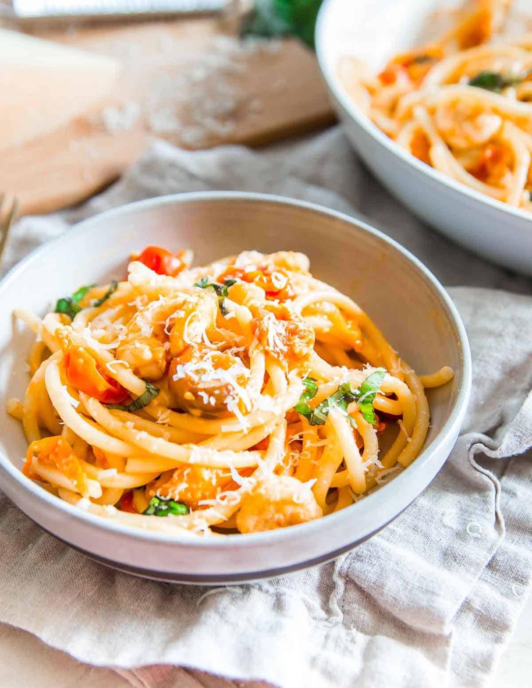 Looking for an easy weeknight meal? Grab some frozen shrimp, cherry tomatoes and a box of pasta from the pantry for this bucatini with garlic shrimp recipe.