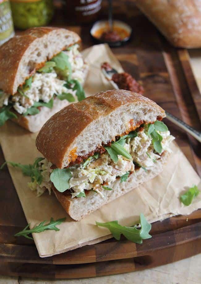Garlic yogurt chicken salad sandwich with sun dried tomato spread