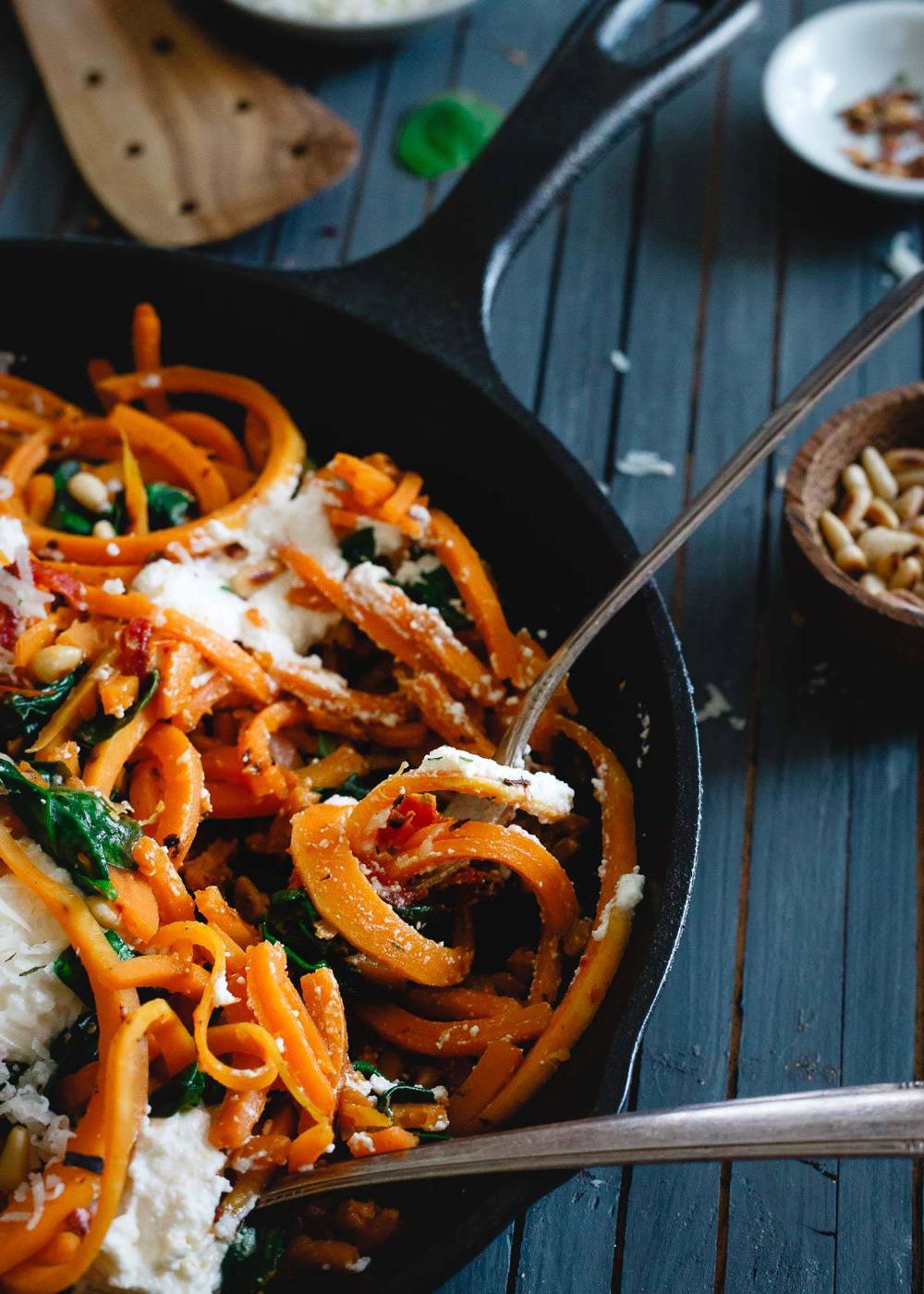 These butternut squash noodles are vegetarian comfort food at its best with wilted baby spinach, sun-dried tomatoes, toasted pine nuts and fresh ricotta.