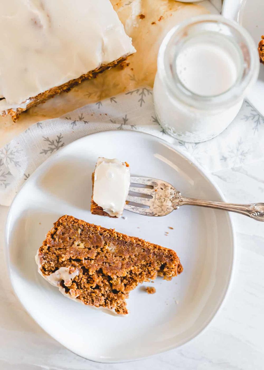 Moist gingerbread banana loaf slice on a plate.