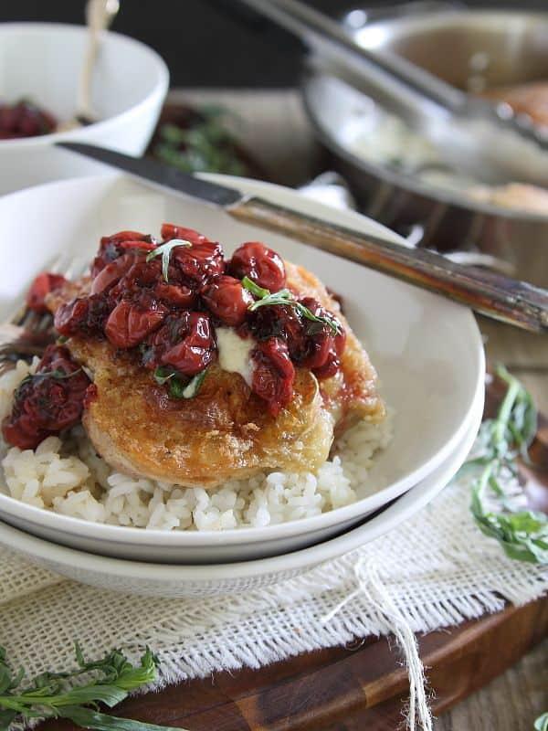 Fried chicken in a creamy goat cheese sauce topped with tarragon tart cherries