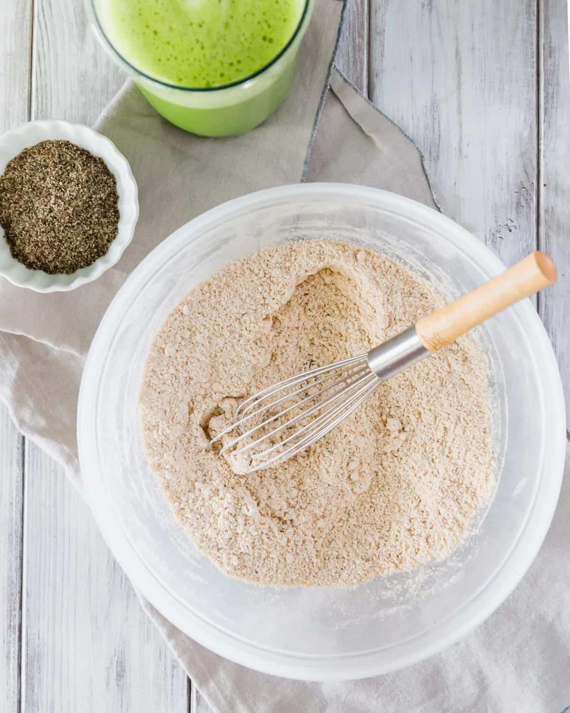 Ingredients for making spinach pancakes include oat flour, ground chia seeds and baby spinach blended with almond milk.