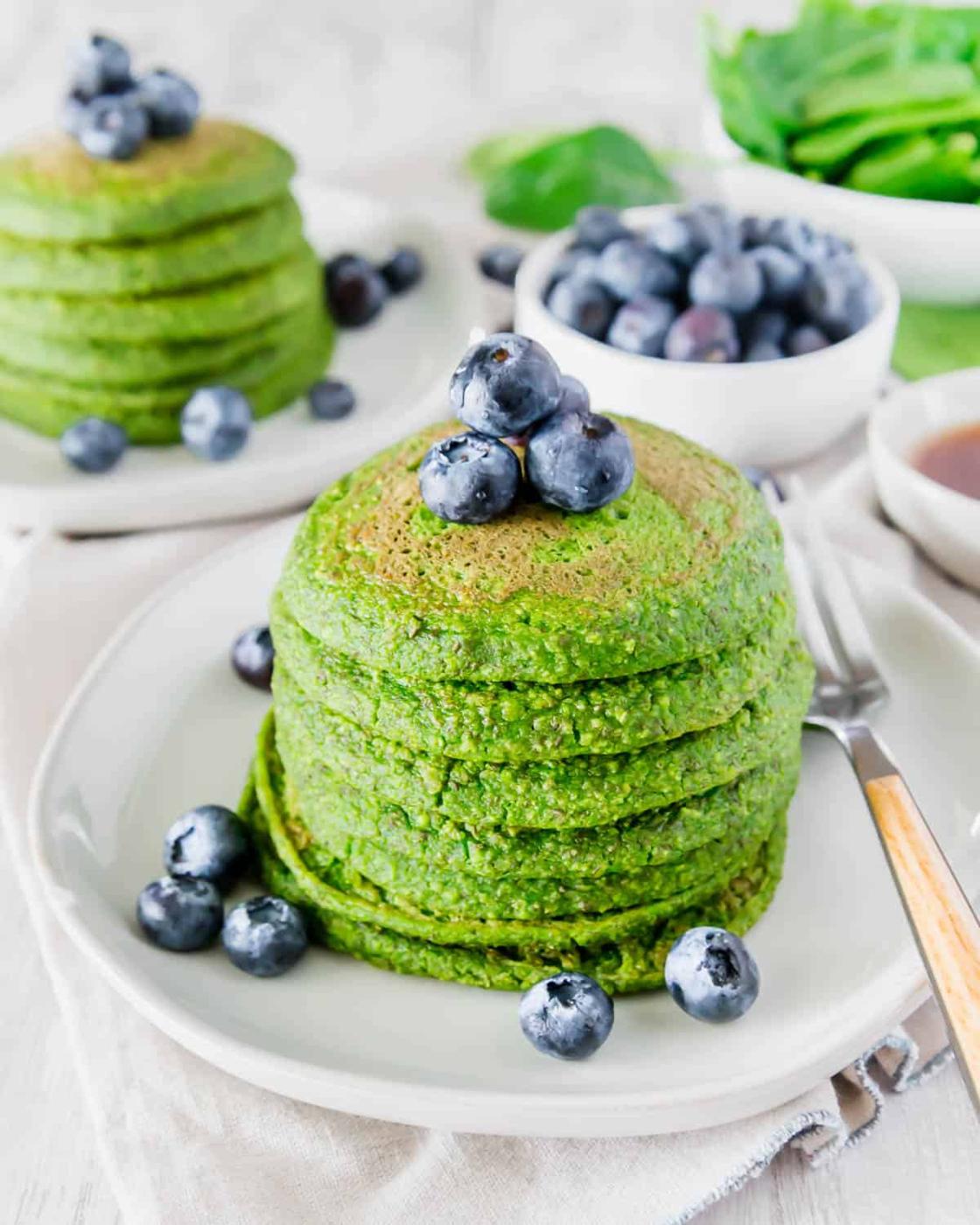 Green pancakes made with fresh spinach have absolutely no food coloring in them for a healthy and festive breakfast!