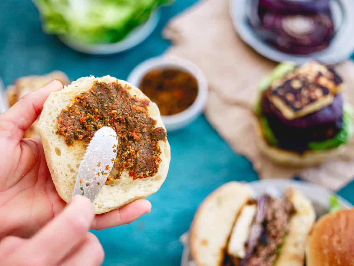 The sun-dried tomato pesto spread makes each bite of these lamb burgers burst with Mediterranean flavor.