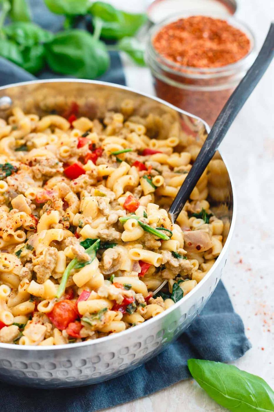 This 30 minute one-pot turkey skillet mac and cheese is like a grownup version of hamburger helper filled with spinach, peppers and real cheddar cheese.