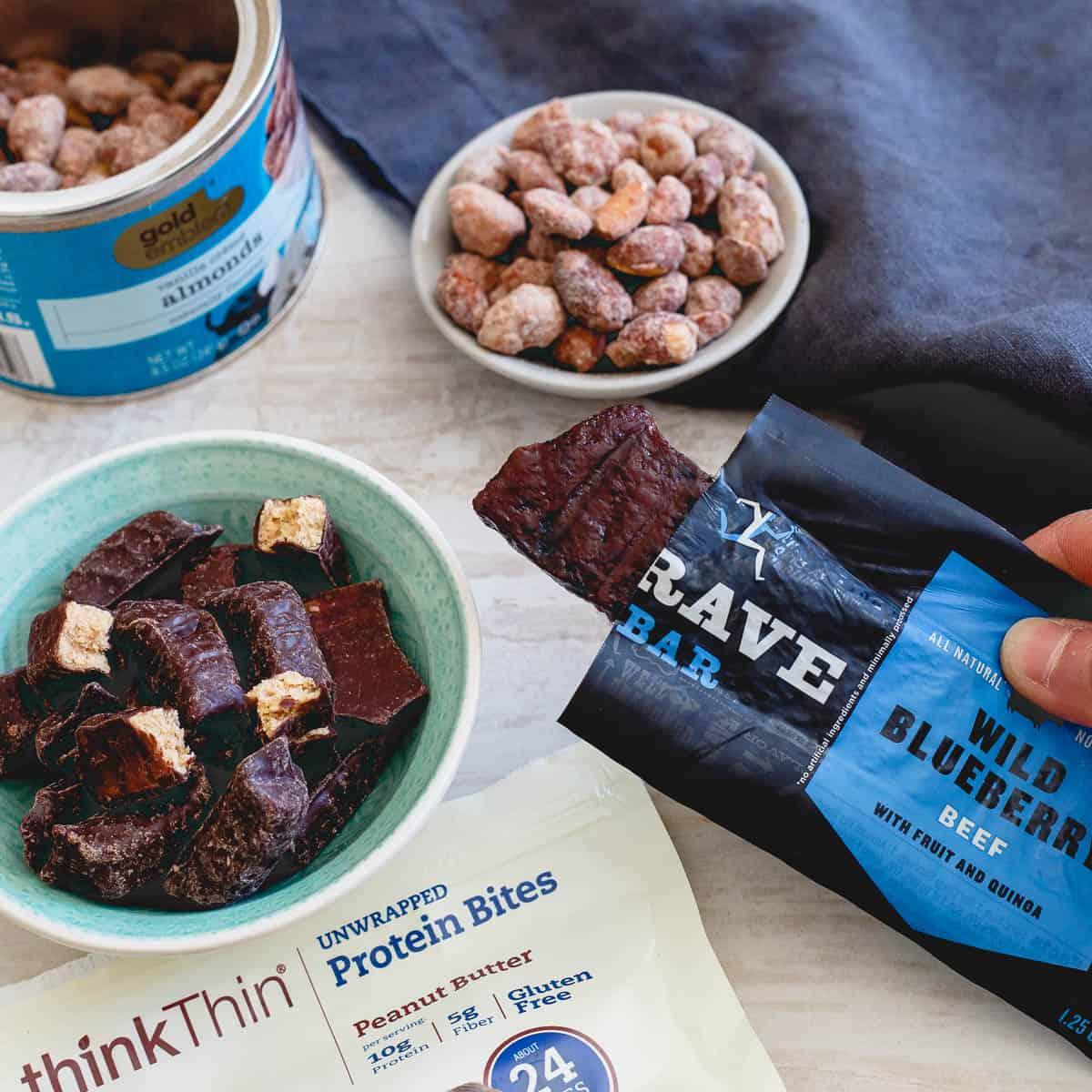 Nuts, chocolate covered protein bites and a jerky bar make a protein packed powerhouse of an afternoon snack. Great for munching on before your workout too!
