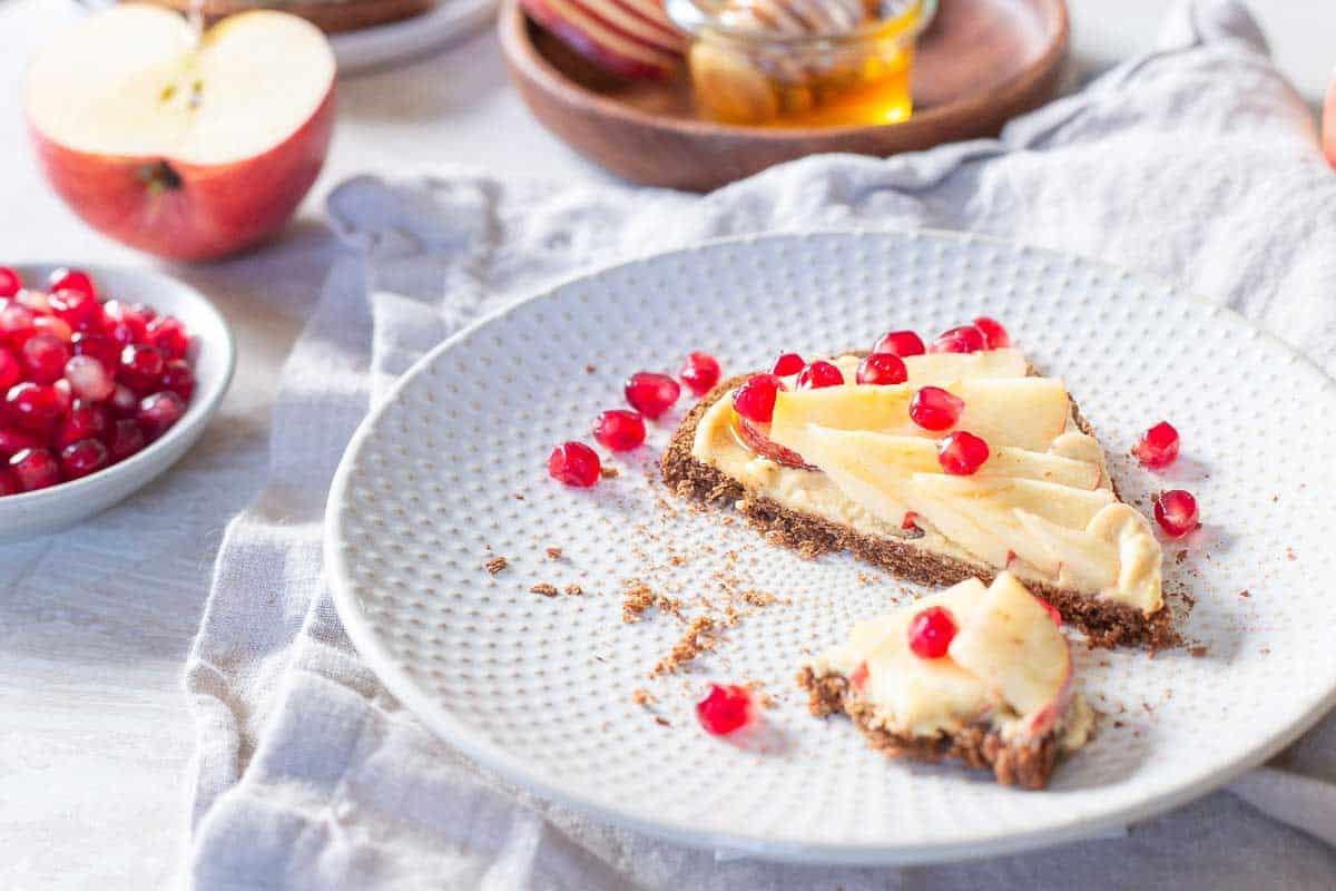 Try hummus toast next time you need a quick, easy and healthy snack and top with your favorite fruit like apple slices and pomegranates.