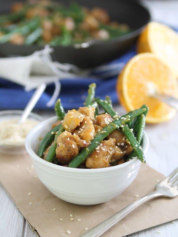 This honey orange sesame chicken dish is an easy, healthy takeout fake-out meal you can make in minutes at home.