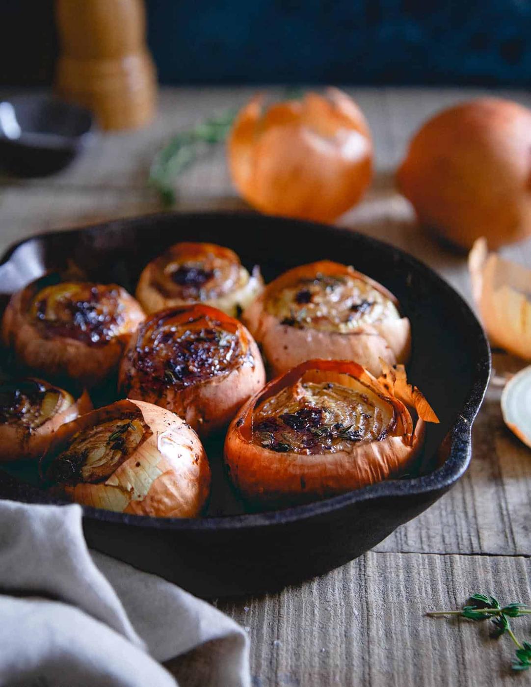 Roasting whole onions with thyme, balsamic and butter leaves them buttery, soft and almost melting in your mouth. A great winter side dish!