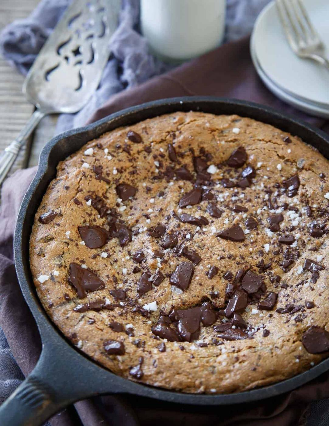 Paleo chocolate chip cookie skillet in a cast iron pan.