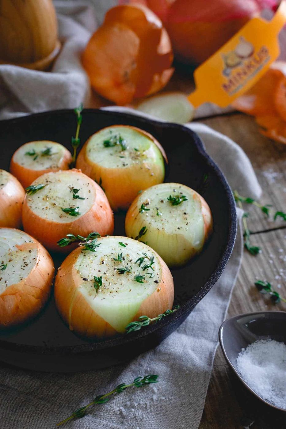 Whole roasted onions are seasoned with fresh thyme, salt, pepper, butter and sweet balsamic vinegar for delicious side dish.
