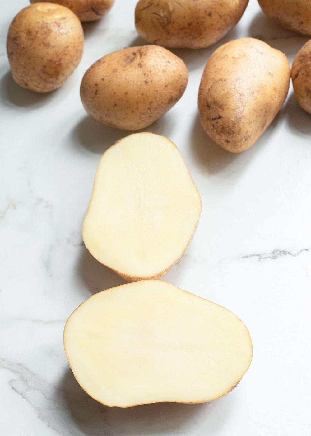 Yellow potatoes cut in half.