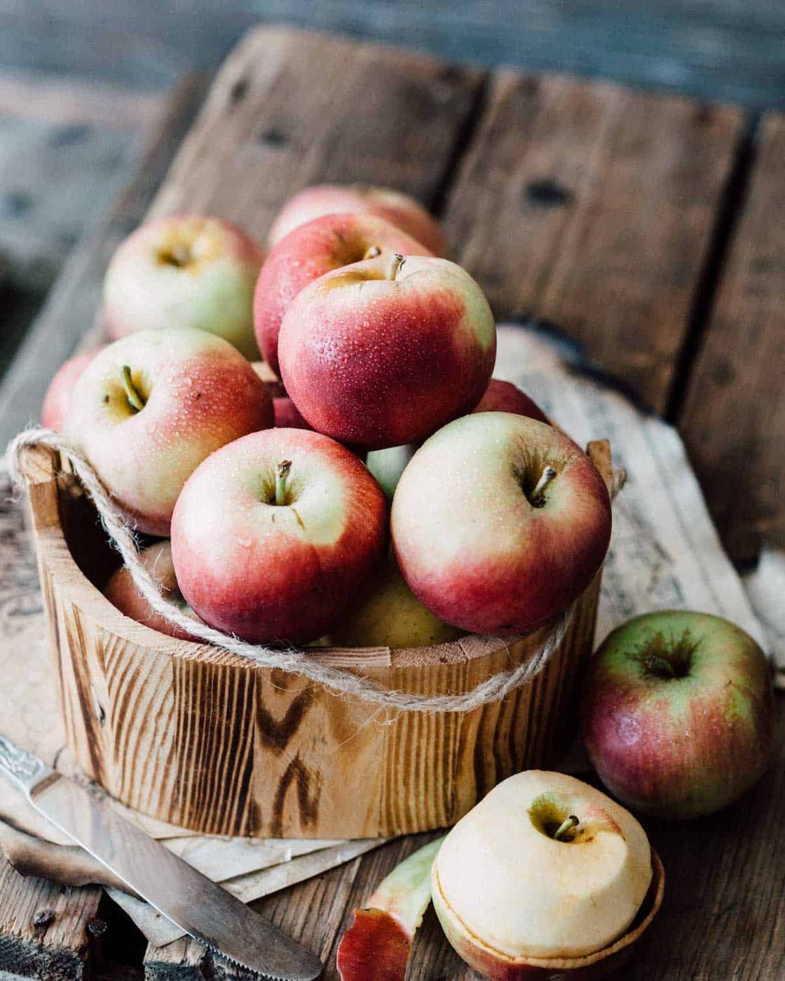 Apples in a wooden bucket.