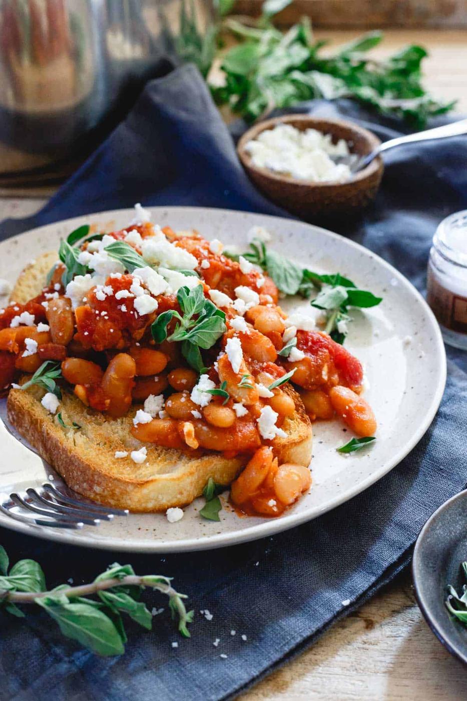 Instant Pot tomato white beans are made in a fraction of the time by using a pressure cooker. It's a hearty winter meal perfect over some toasted sourdough bread.